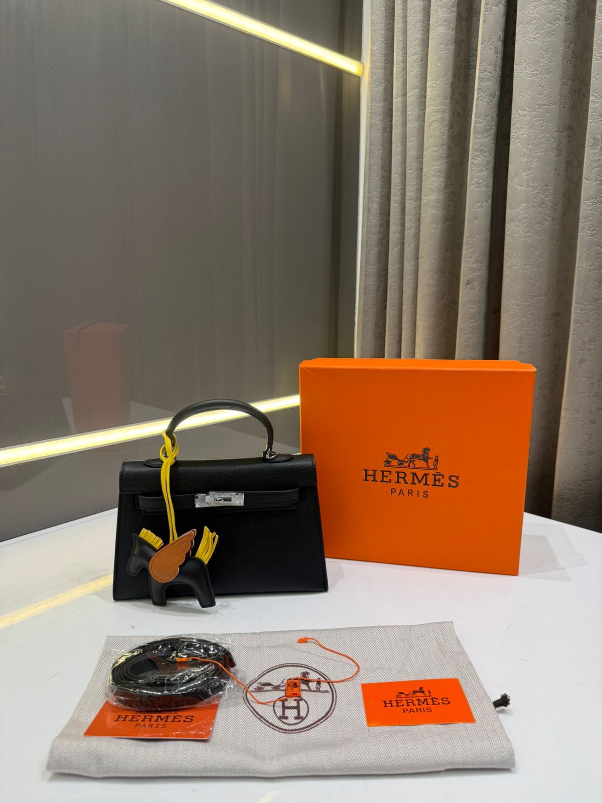 *HERMES KELLY ADORNED WITH HORSE SHAPED PREMIUM LEATHER HAND BAG